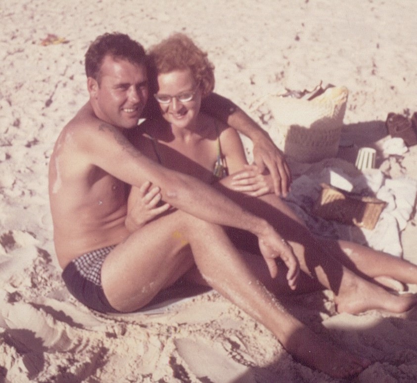 Old picture of a couple on the beach
