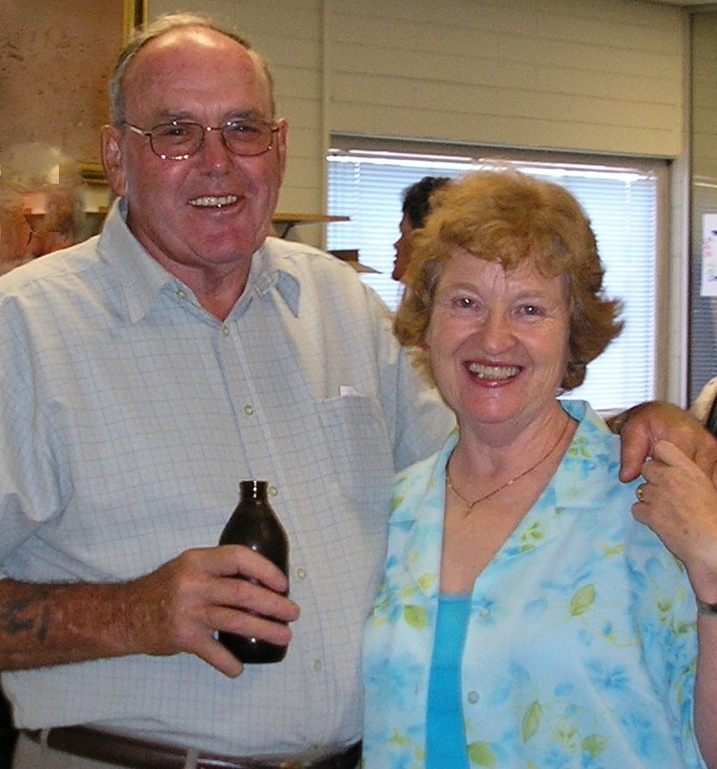Senior man and woman smiling at camera