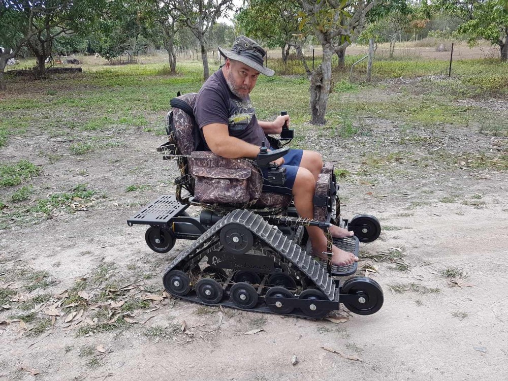 50-year-old man on an all terrain wheelchair