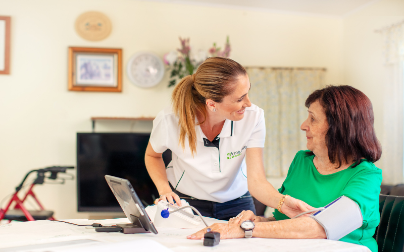 Female Feros Care client with a female Feros Care nurse in the client's home.