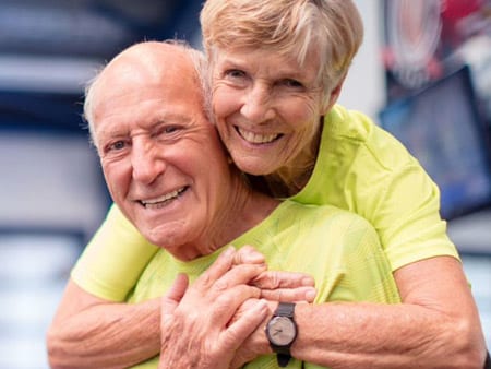 Photo-of-elderly-woman-hugging-elderly-man