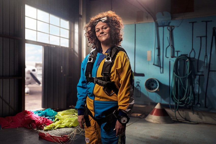 Korrine wearing skydiving gear.