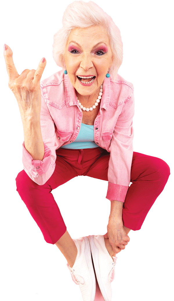 Photo of senior woman with big smile and holding up rock and roll hand gesture