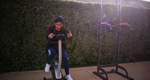 Indian woman using an exercise bike