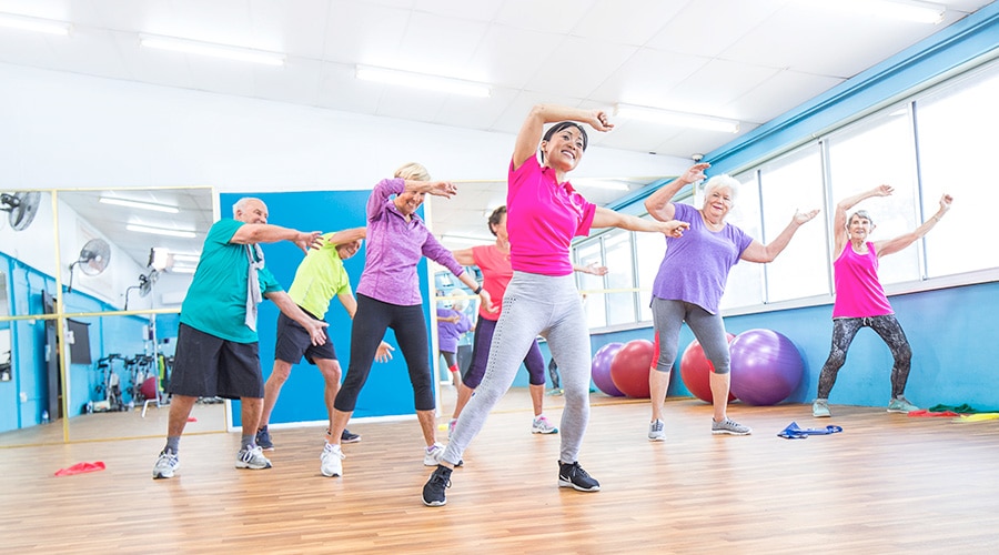 Feros Care team member taking seniors exercise class